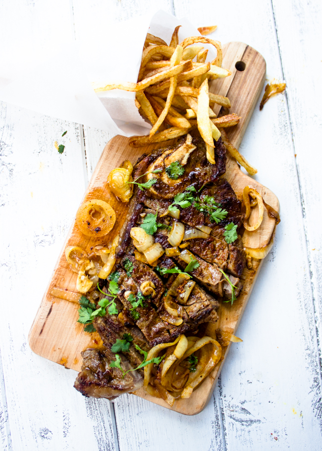 Pan Seared New York Strip Steak with Garlic Butter Sauce + Onions