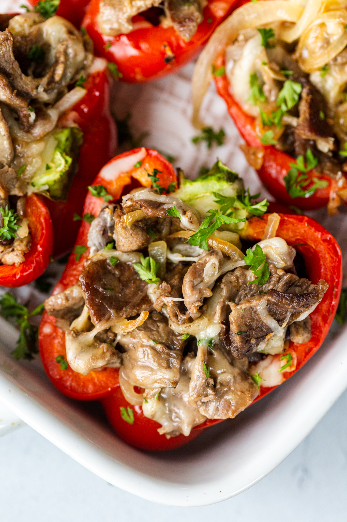 Stuffed peppers with steak in a baking dish