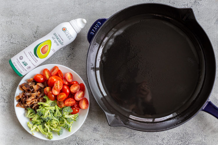 An oiled pan and a plate with veggies and bacon