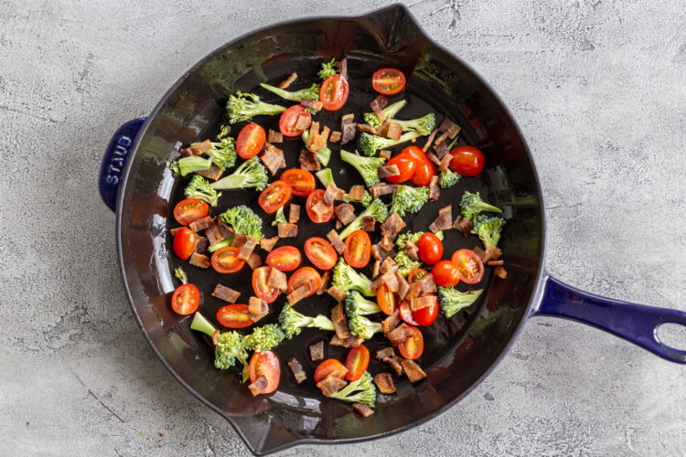 a pan with bacon and veggies