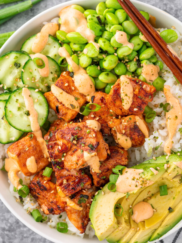 Salmon Maki bowl assembled with rice, salmon, avocado, cucumbers, edamame and spicy mayo.