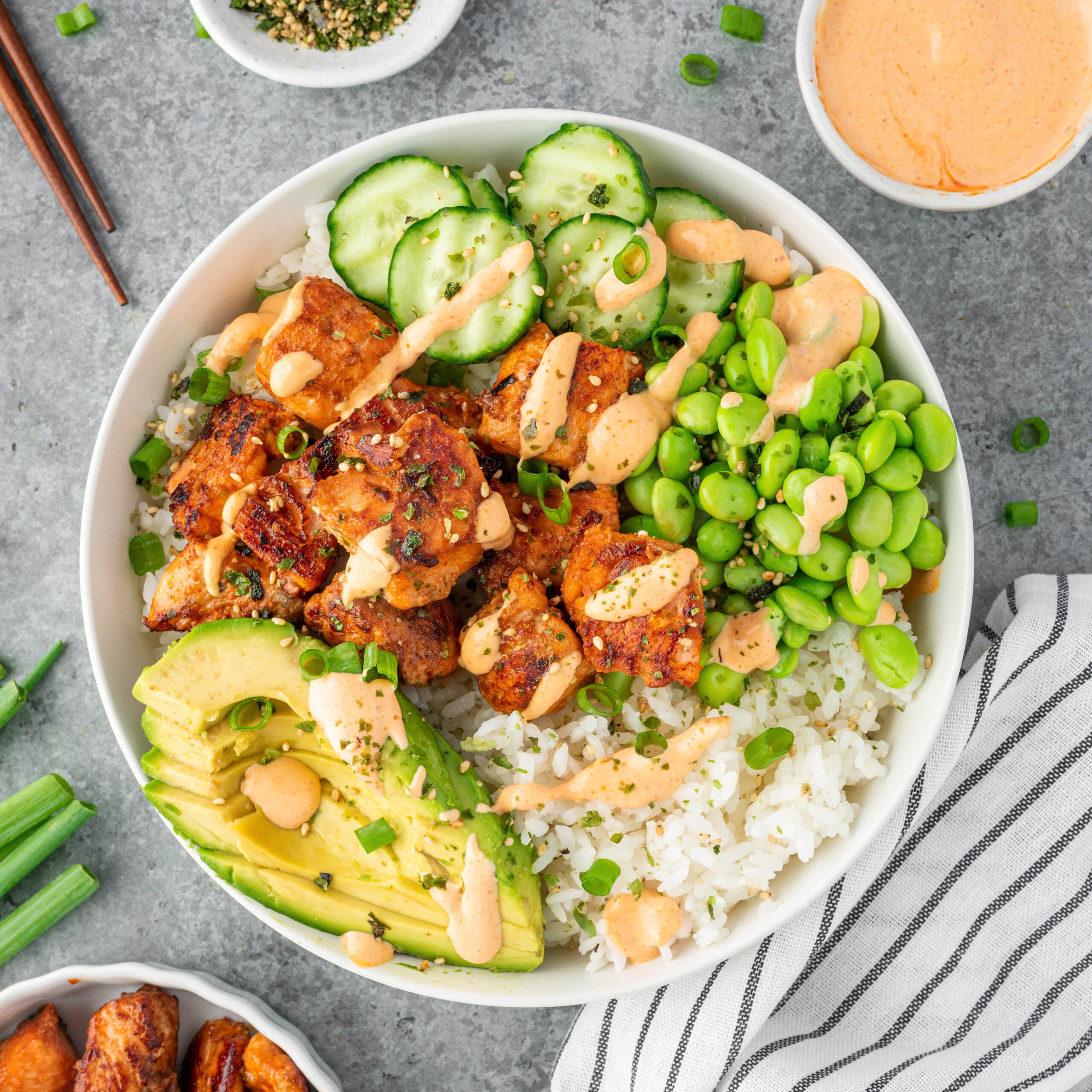 Salmon Maki Bowl served with edamame, cucumber, avocado and rice.