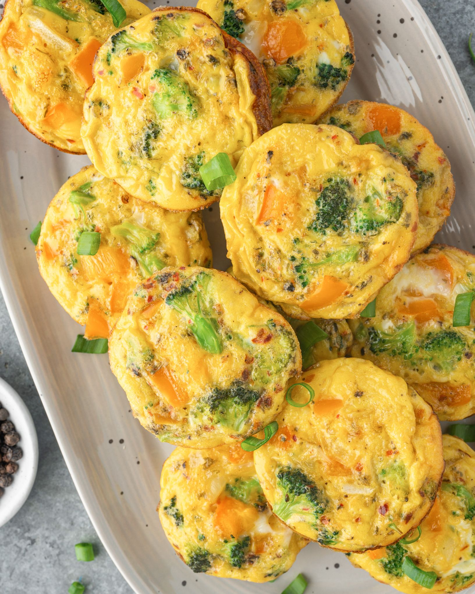 Breakfast egg muffin on a white serving tray.