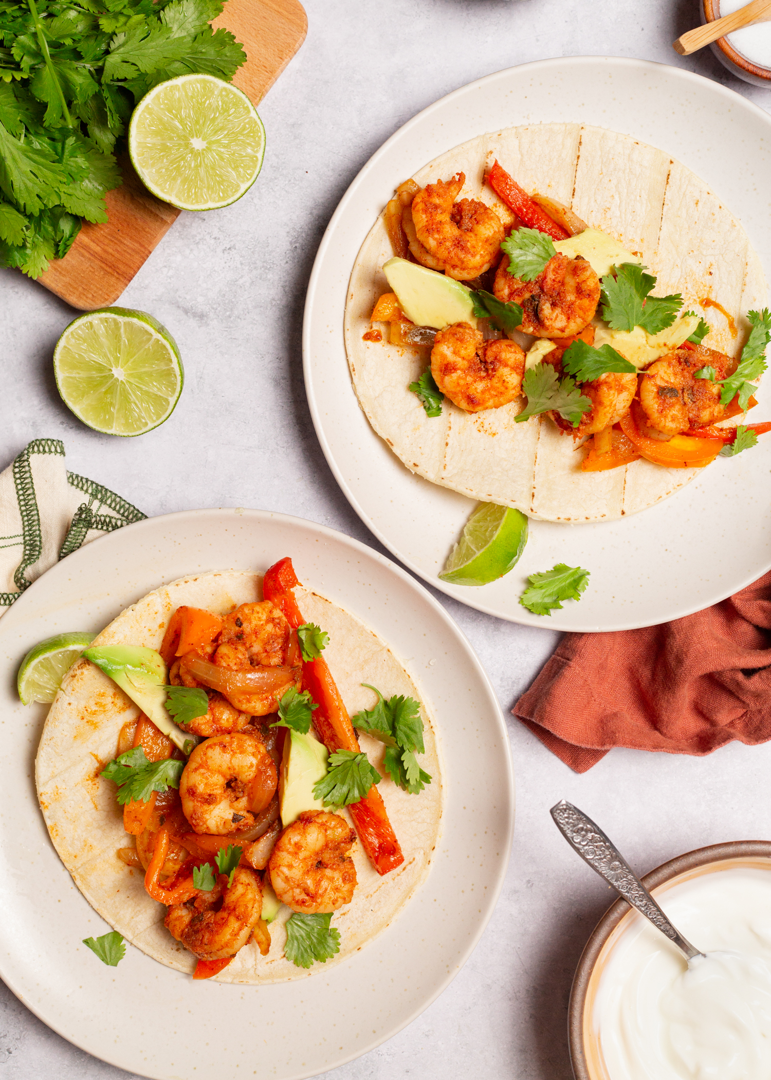 Topping tortillas with shrimp fajitas mix.